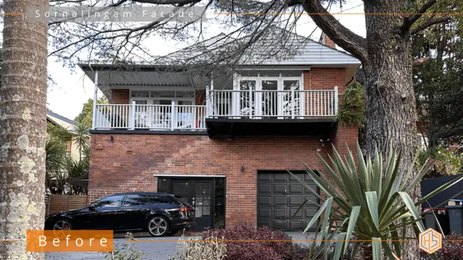 Image of a vintage unrenovated two-story brick home with white balustrade, showcasing 1960s architectural charm.